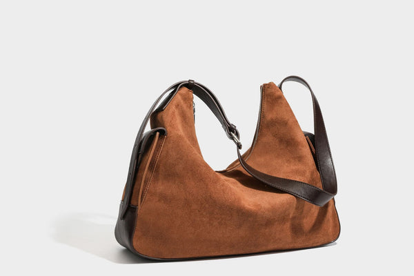 Slouchy cognac brown matte suede-look hobo shoulder bag with dark brown leather-look trim, top zip closure, front flap