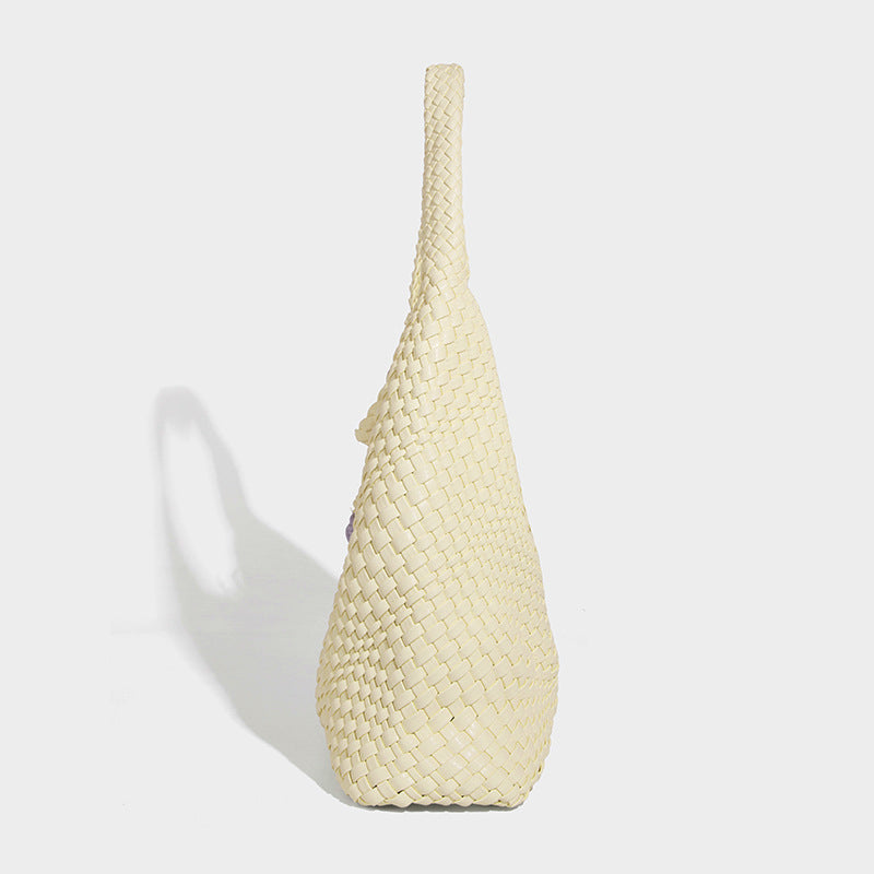 Soft hand-woven slouchy hobo tote bag with knotted tassel charm and single looped shoulder strap, detail view 32