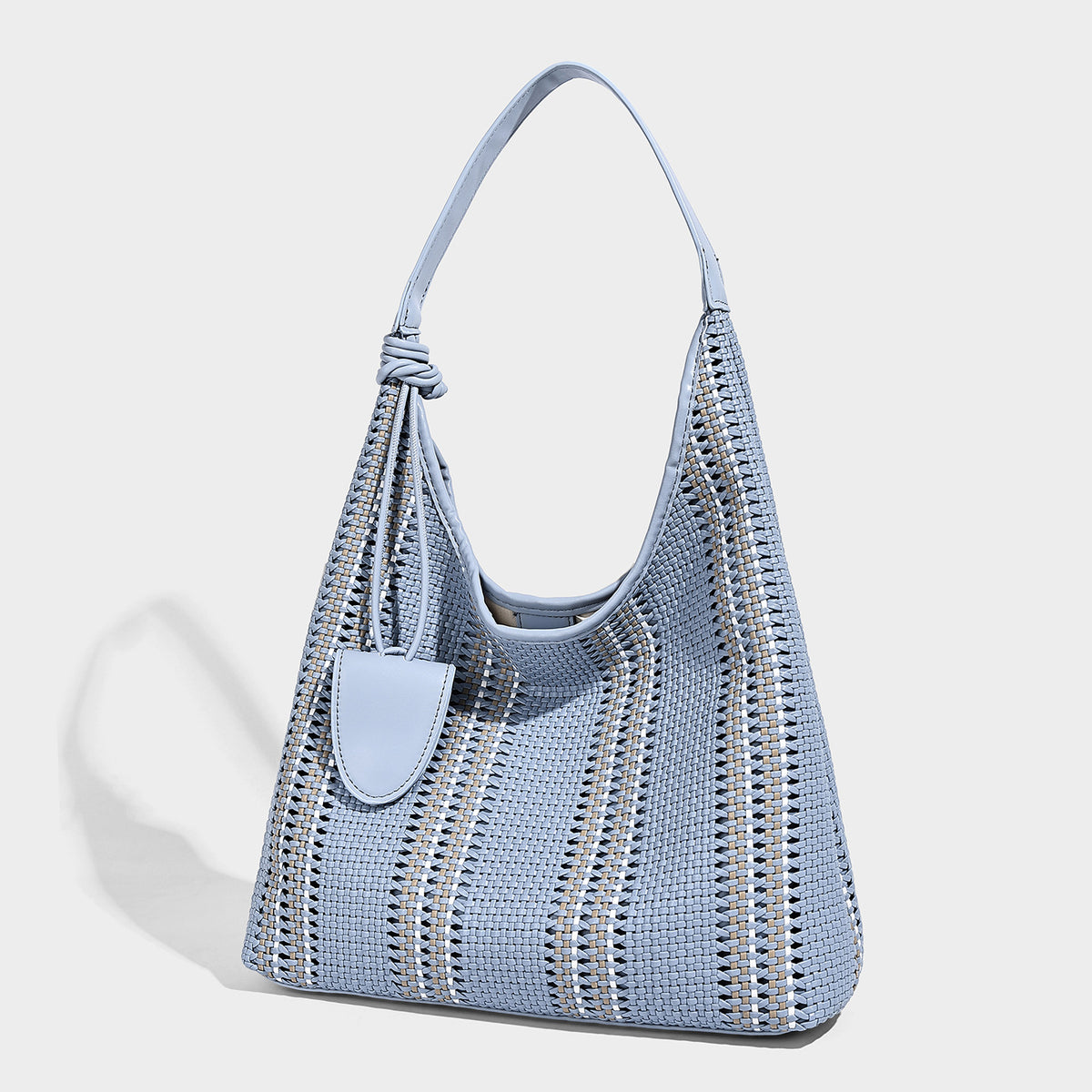 Woven striped slouch shoulder tote bag with knotted strap and attached front flap pouch, detail view 10