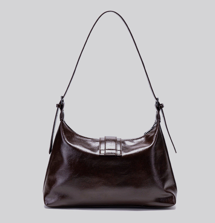 Glossy dark brown slouch hobo shoulder bag with front buckle strap panel and long adjustable single strap, detail view 15