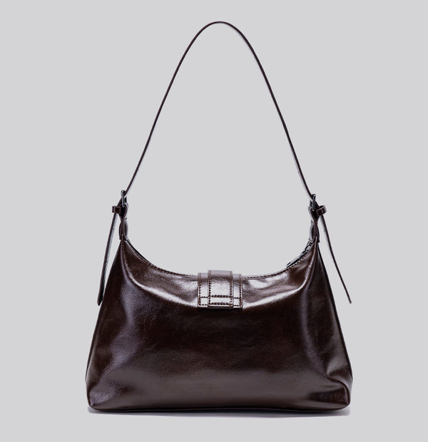 Glossy dark brown slouch hobo shoulder bag with front buckle strap panel and long adjustable single strap, detail view 15