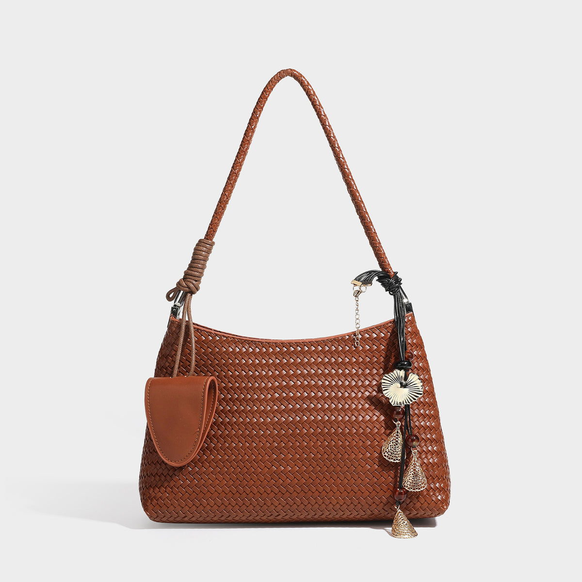 Woven-texture hobo shoulder bag in brown with braided top handle, adjustable crossbody strap, front flap pocket, and, detail