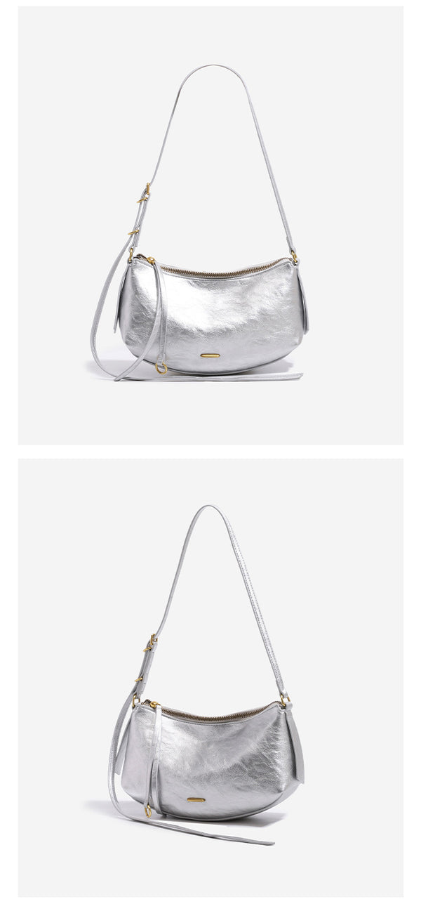 Compact soft rounded zip-top shoulder bag with gold-tone hardware and adjustable crossbody strap, detail view 12