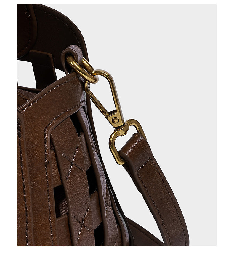 Small structured woven lattice top-handle satchel bag with bead-and-tassel charm and gold-tone hardware, detail view 11