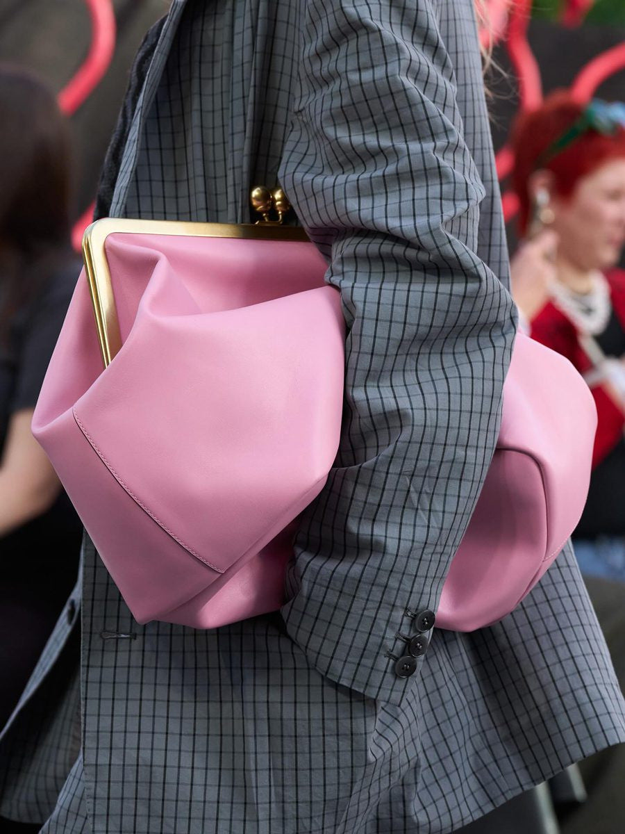 Oversized kiss-lock frame handbag with gold-tone metal clasp and smooth leather-look finish, detail view 19
