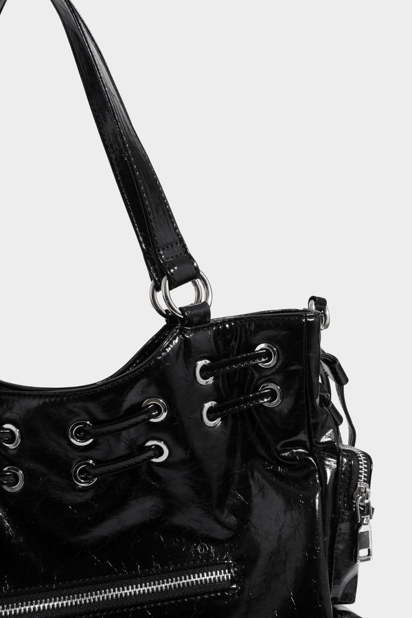 Glossy crinkled leather-look tote bag with silver grommet lace-up front detail, dual top handles, and detachable shoulder