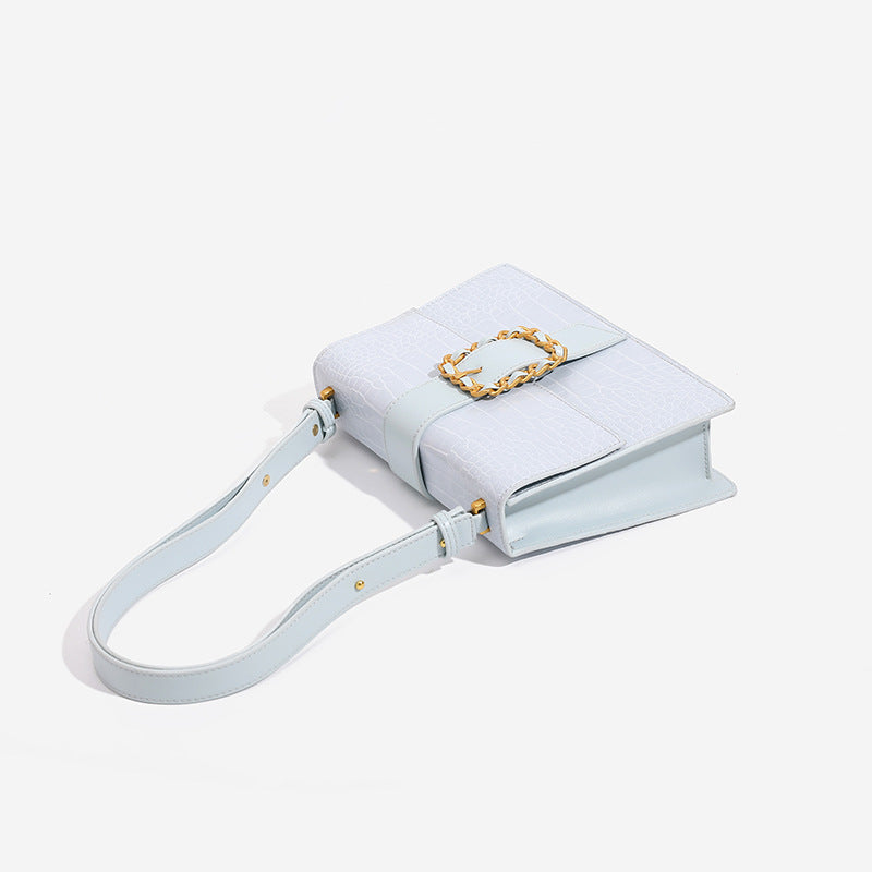 Structured crocodile-embossed flap shoulder bag with gold chain buckle hardware and adjustable strap, detail view 4