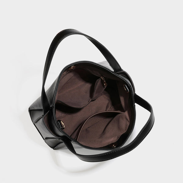 Black glossy crinkled leather-look convertible shoulder tote bag with gold gourd-shaped emblem hardware and detachable