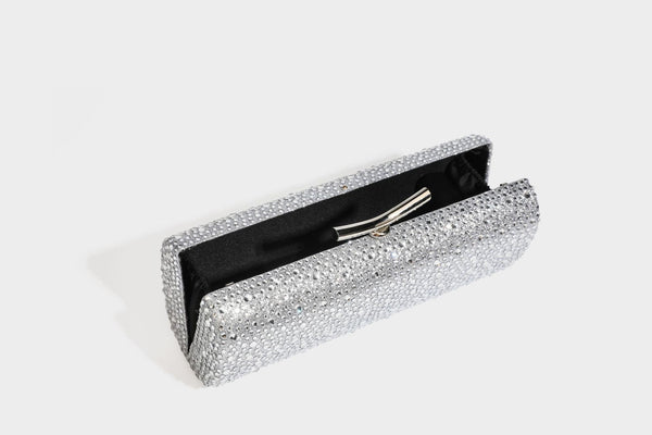 Structured rectangular hard-case clutch bag covered in all-over rhinestone crystal embellishment with curved kiss-lock top