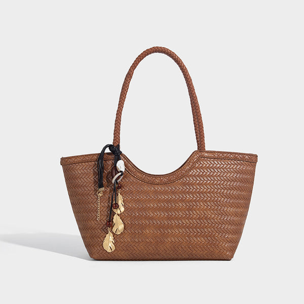 Large open-top woven tote bag with contrasting braided double handles and matching drawstring pouch, detail view 7
