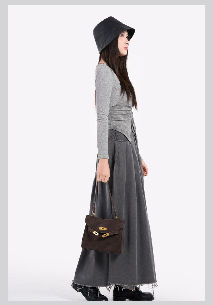 Structured dark brown flap satchel with gold-tone turn-lock hardware and detachable shoulder strap, detail view 10