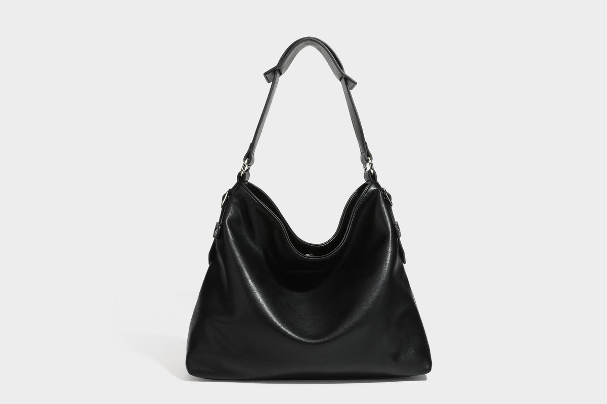 Large slouchy hobo shoulder bag in dark brown with smooth leather-look finish, adjustable strap, and silver-tone hardware