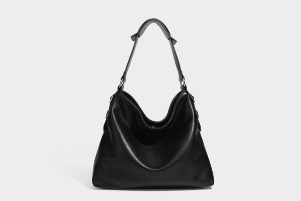 Large slouchy hobo shoulder bag in dark brown with smooth leather-look finish, adjustable strap, and silver-tone hardware