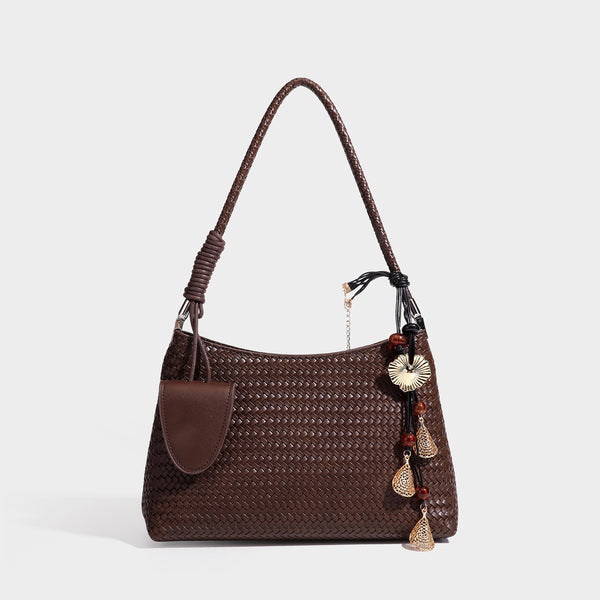 Woven-texture hobo shoulder bag in brown with braided top handle, adjustable crossbody strap, front flap pocket, and, detail