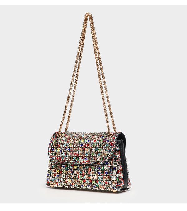 Structured mini flap crossbody bag covered in grid-set rhinestones with silver-tone chain strap, detail view 9