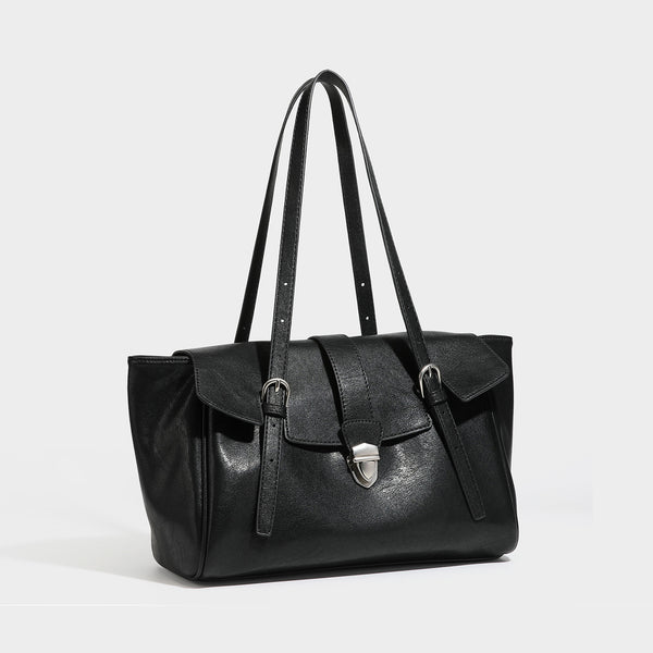 Large structured vintage-style tote bag with flap-front turn-lock closure, twin buckle straps, and double shoulder handles