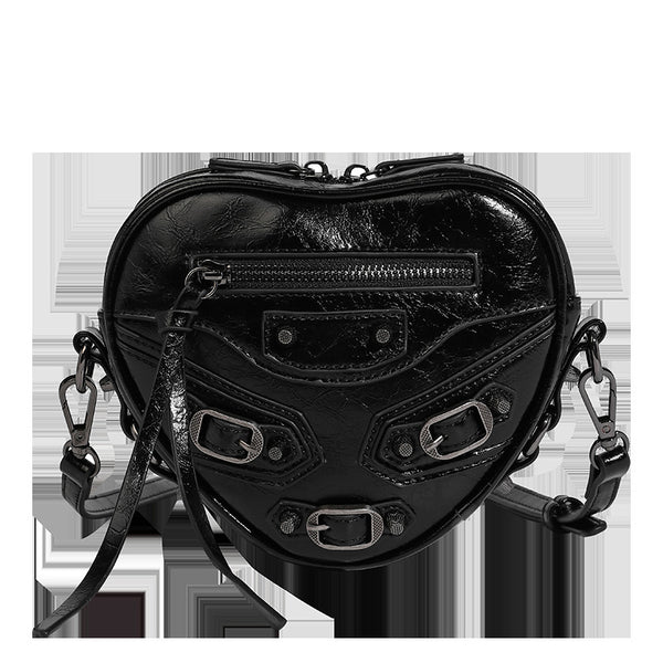 Mini heart-shaped crossbody bag with glossy crinkled finish and moto buckle hardware, detail view 16