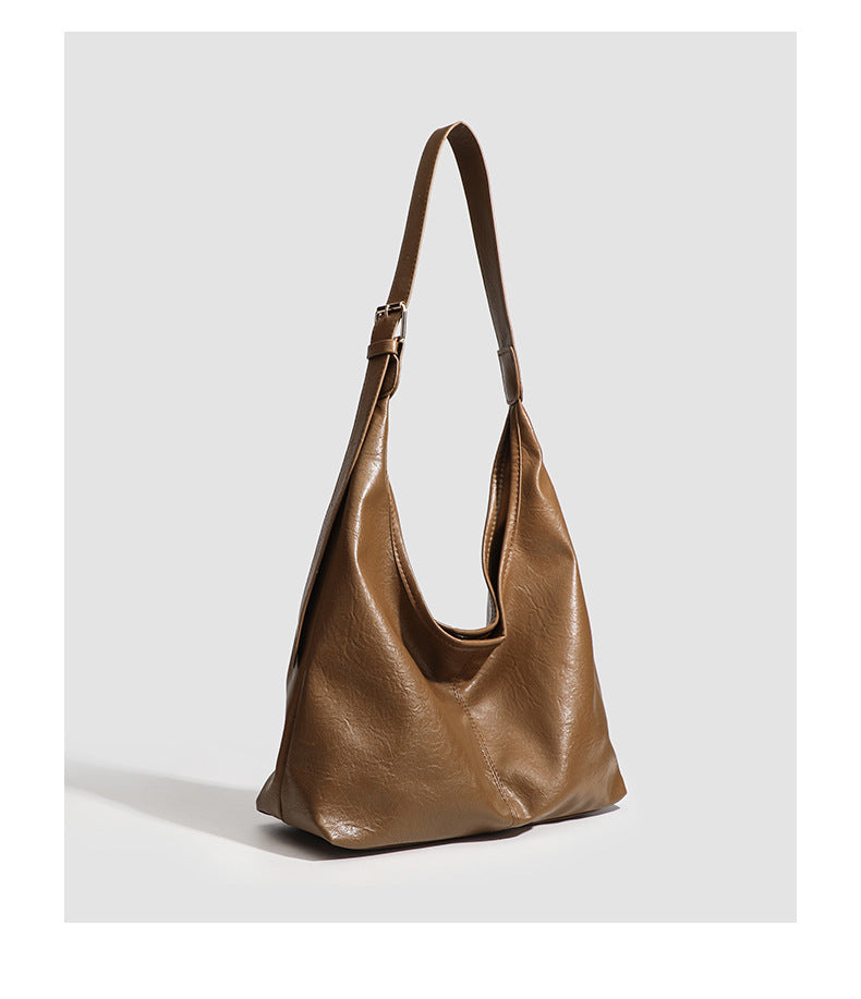 Large slouchy hobo shoulder bag in smooth leather-look finish with adjustable strap and gold-tone hardware, detail view 19