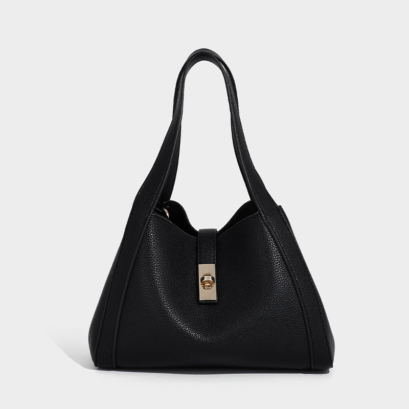 Structured trapezoid tote bag in taupe pebbled leather-look finish with gold-tone turn-lock hardware, dual top handles, and
