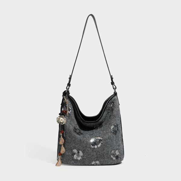Lässig fallende Hobo-Schultertasche aus anthrazitfarbenem Webstoff mit floraler Stickerei aus silberfarbenen Pailletten, Besatz in schwarzer Lederoptik und lang