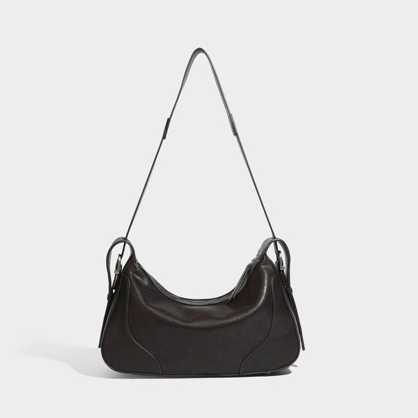 Slouchy crescent hobo shoulder bag in dark brown pebbled leather-look finish with zip top and long shoulder strap, detail
