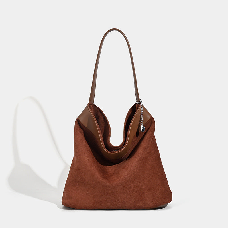 Slouchy open-top hobo bag in matte suede-finish with smooth leather-look trim and single shoulder strap, front view