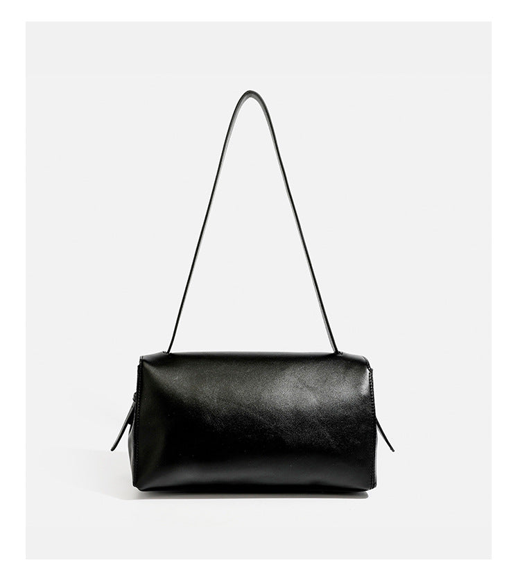 Structured rectangular flap shoulder bag with smooth leather-look finish, silver-tone turn-lock clasp, and long slim