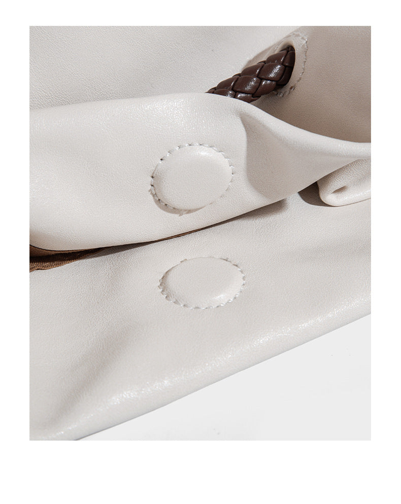 Cream slouchy drawstring bucket bag with braided cord, beaded tassel charm, and gold-tone ring hardware, detail view 13
