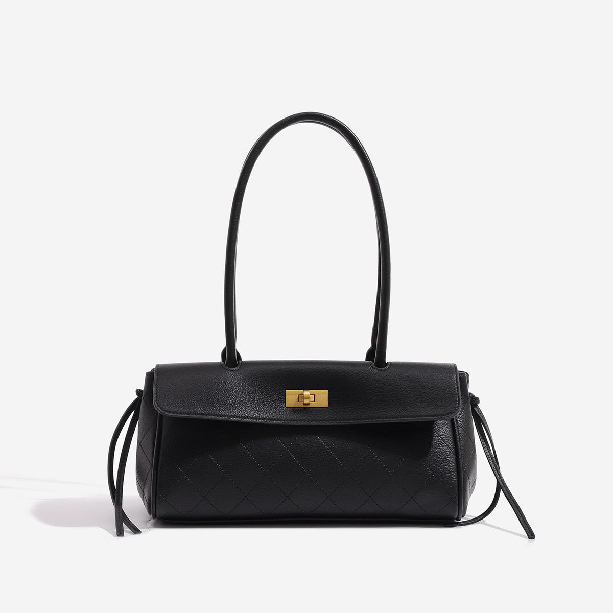 Structured black baguette bag with diamond-quilted front panel, gold-tone turn-lock flap closure, and dual looped top