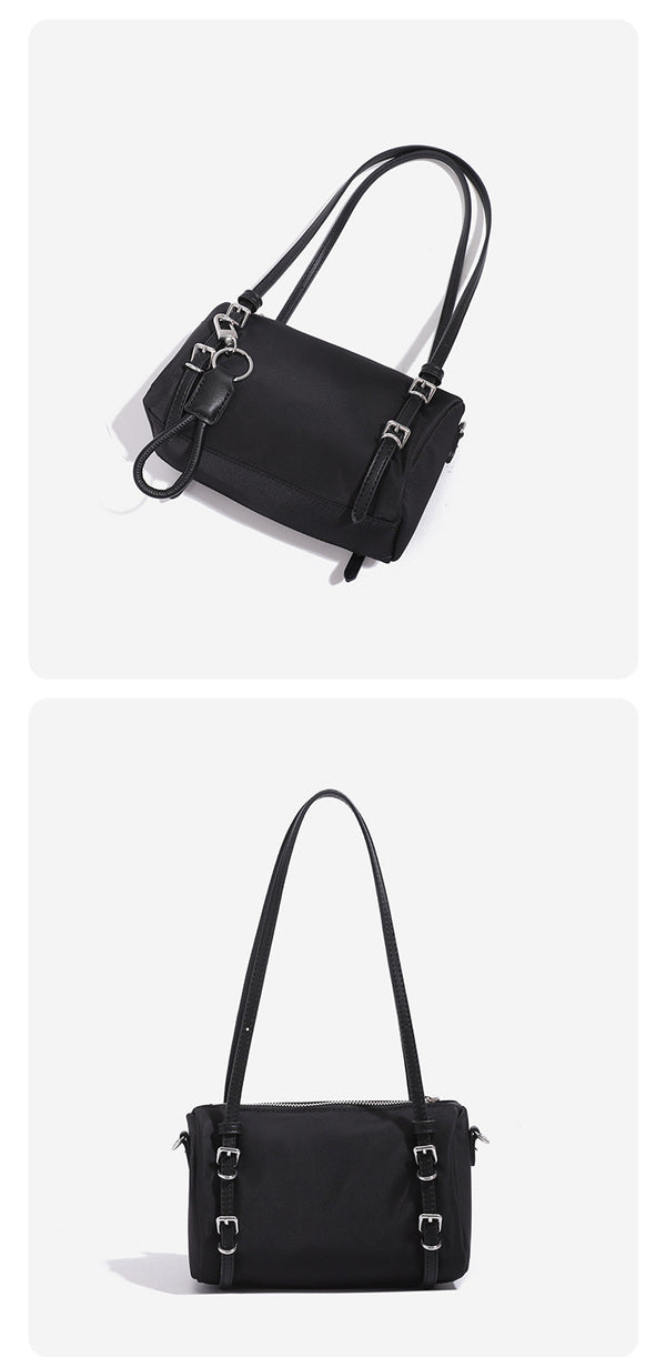 Compact nylon Boston barrel bag with zip-top closure, silver-tone hardware, dual slim handles, and detachable crossbody