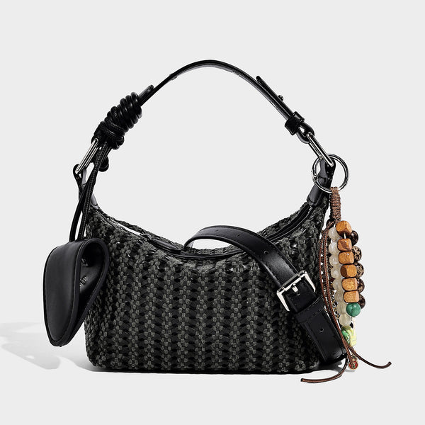 Woven crescent shoulder bag with leather-look knotted handle, zip top, attached mini pouch, and silver-tone hardware, detail