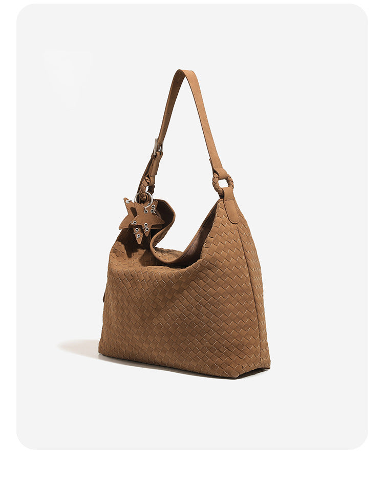 Slouchy woven hobo shoulder bag with matte suede-like finish, adjustable strap, and star charm hardware, detail view 9