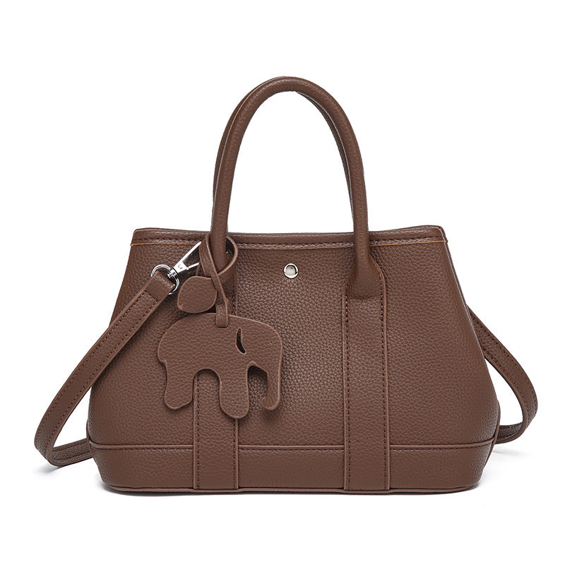 Structured pebbled leather-look top-handle tote bag with elephant charm and detachable shoulder strap, detail view 6