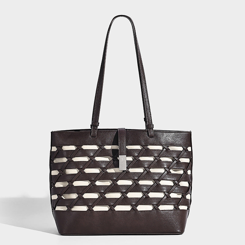 Structured woven lattice cutout tote bag with smooth leather-look trim, dual shoulder straps, and silver-tone hardware