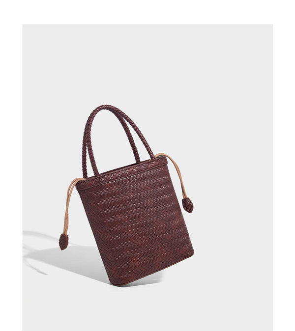 Small structured woven-texture tote bag with braided top handles and drawstring inner pouch, detail view 15