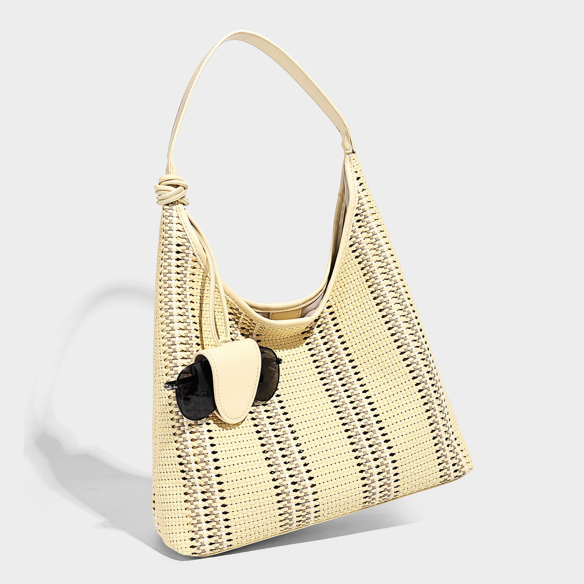 Woven striped slouch shoulder tote bag with knotted strap and attached front flap pouch, detail view 4