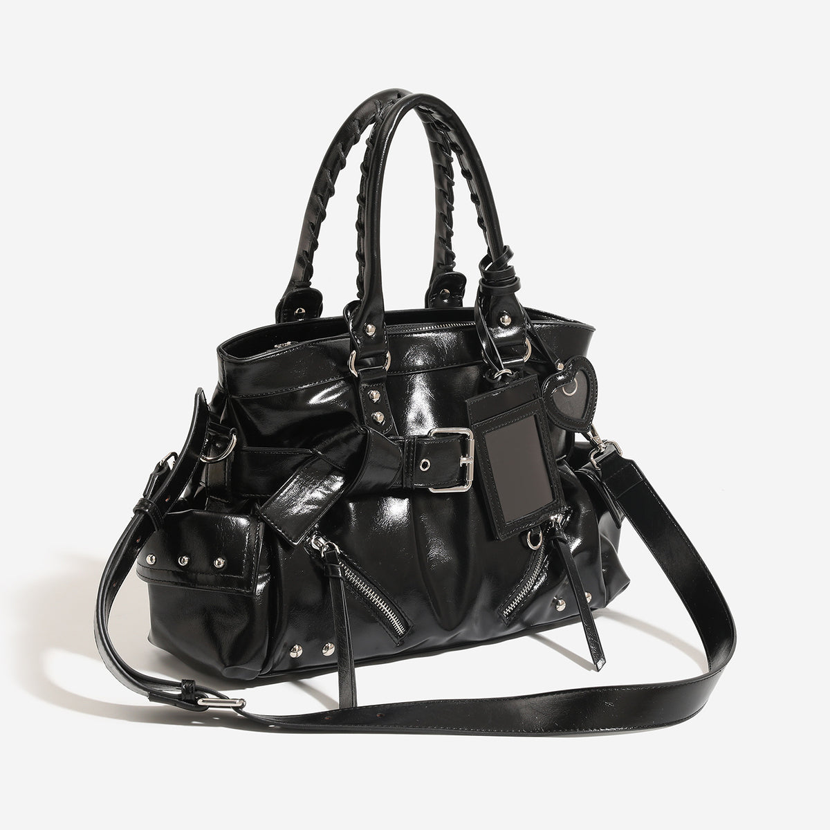 Black glossy leather-look structured tote bag with silver studs, buckle strap, exterior zip pockets, braided top handles