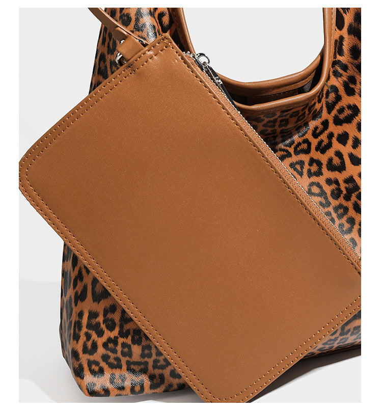 Glossy leopard-print slouchy shoulder bag with long strap and detachable tan zip pouch, detail view 17