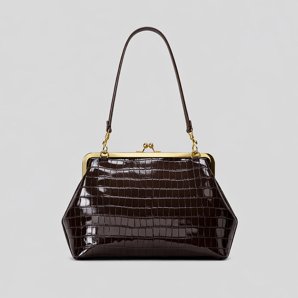 Trapezoid kiss-lock frame shoulder bag with gold-tone hardware and slim adjustable strap, detail view 13