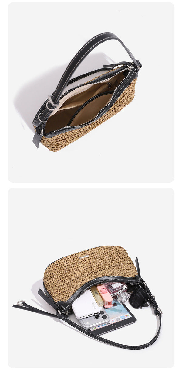 Tan woven straw half-moon shoulder bag with black leather-look trim, zip closure, tassel pull, and adjustable crossbody
