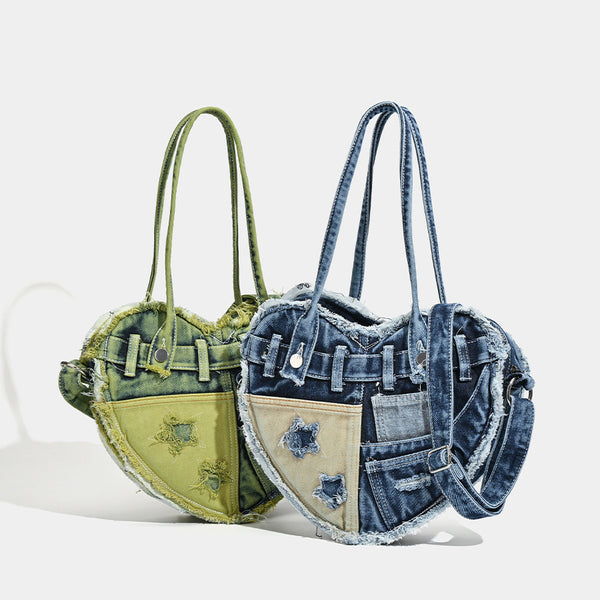 Heart-shaped patchwork washed denim shoulder bag with frayed edges, front patch pockets, and metal hardware, detail view 2