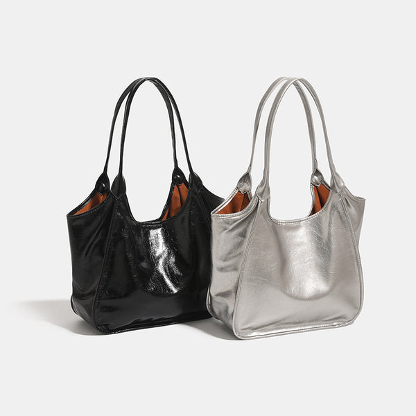 Large open-top shoulder tote bag with glossy crinkled metallic finish and long double straps, detail view 2
