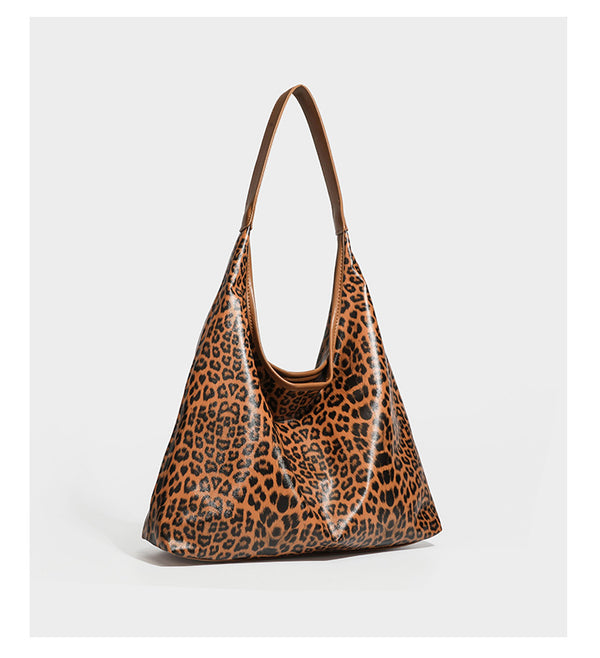 Glossy leopard-print slouchy shoulder bag with long strap and detachable tan zip pouch, detail view 10