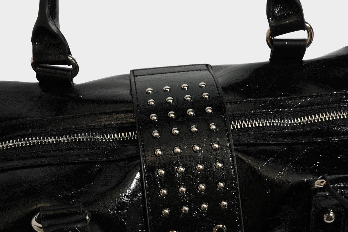 Glossy crinkled barrel handbag with silver stud buckle strap and detachable shoulder strap, detail view 32