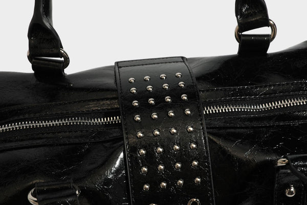 Glossy crinkled barrel handbag with silver stud buckle strap and detachable shoulder strap, detail view 32