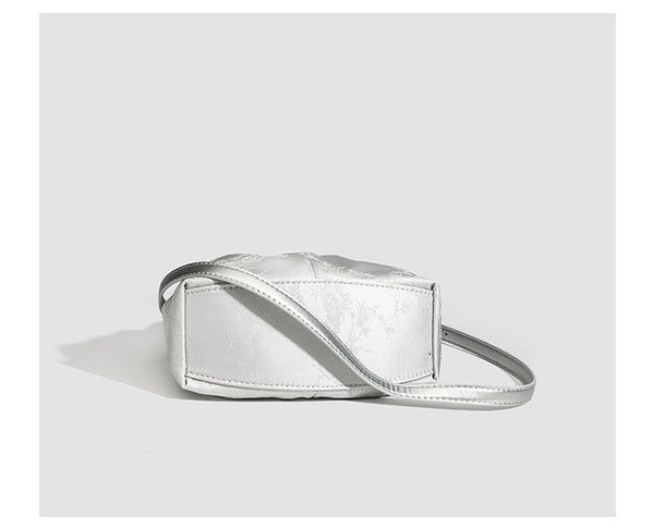 Small ruched satin-finish cloud bag with elasticized drawstring top, short top handle, and chunky silver-tone chain strap