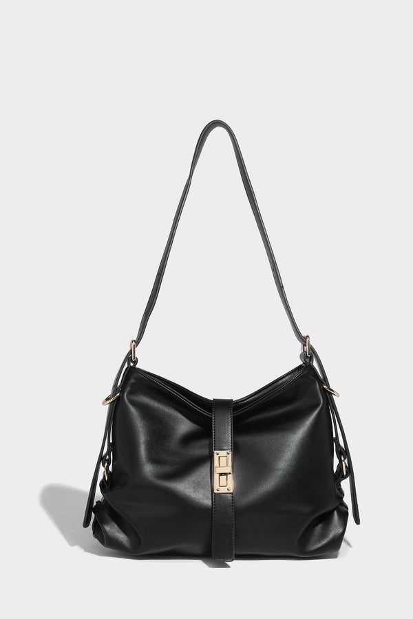 Soft slouchy hobo shoulder bag with smooth leather-look finish, gold-tone buckle and tab hardware, and long adjustable strap