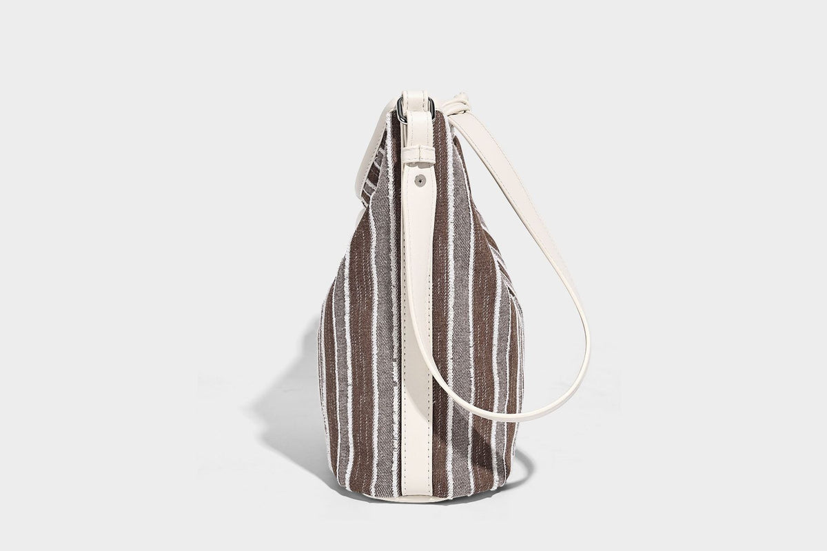 Large striped canvas hobo shoulder bag with cream trim and silver-tone hardware, detail view 14