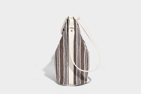 Large striped canvas hobo shoulder bag with cream trim and silver-tone hardware, detail view 14