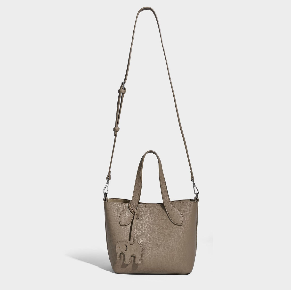 Compact pebbled bucket tote bag with elephant charm, twin top handles, and detachable crossbody strap, detail view 14